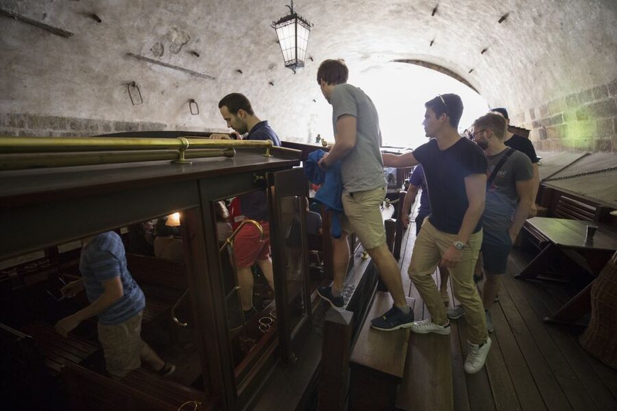 Prague: 3–Hour Castle Grounds Walking Tour and River Cruise - Taking the tram up to Prague Castle