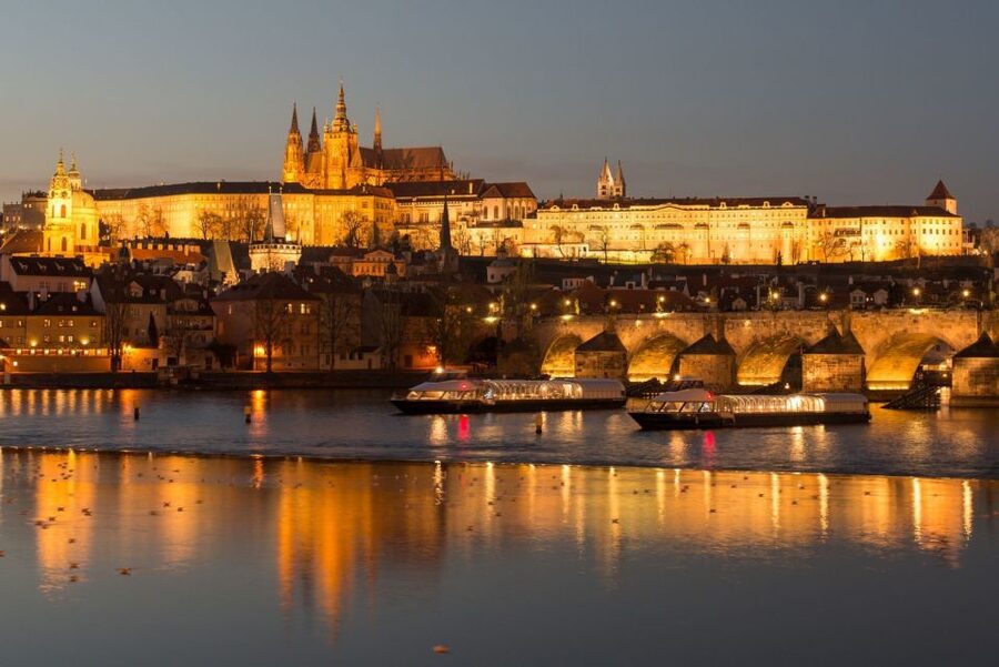 Prague: City Tour and Dinner Cruise with Hotel Pickup - Boarding the boat and settling in for dinner