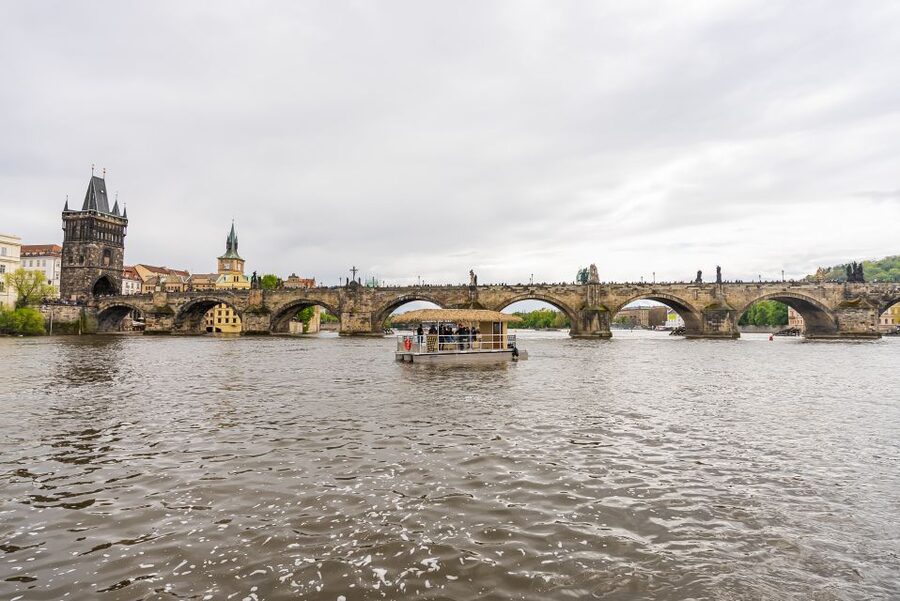 Prague: Party Tiki Boat Sightseeing Cruise with Drinks - Passing Charles Bridge from the water