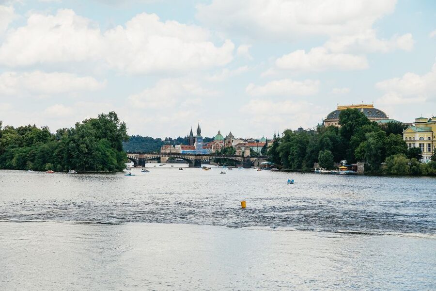 Prague: Vltava River Lunch Cruise in an Open-Top Glass Boat - The Dancing House and the riverfront beyond