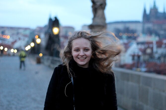 Private Prague Photoshoot for Individuals, Couples and Families - Crossing Charles Bridge with the castle behind you