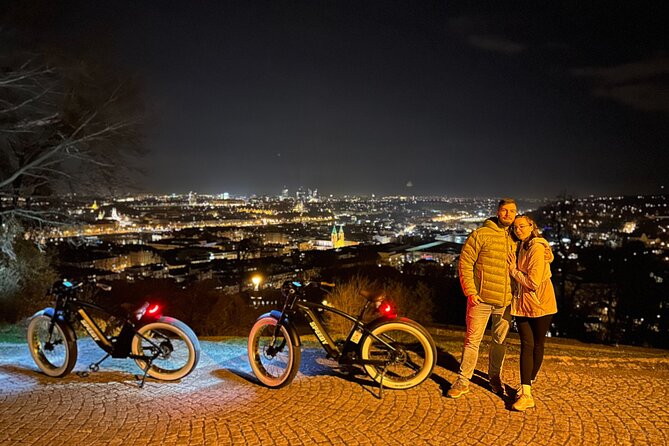 Retro Style E-Bike Night Tour in Prague - Live Guided - Lennon Wall and Charles Bridge beside the river
